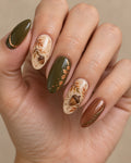 Rustic Acorn Folk Hand-Painted Press-On Nails — on a hand