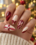 Giftwrap Crossing hand-painted press-on nails — on an adult hand. Design preview.