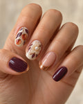 Persimmon Poise Hand-Painted Press-On Nails — on a hand, AI design preview