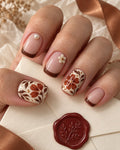 Earthen Floral Tile Hand-Painted Press-On Nails — on a hand, AI design preview
