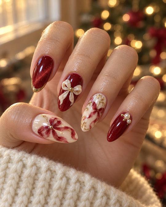 Gilded Knot hand-painted press-on nails — on an adult hand. Design preview.