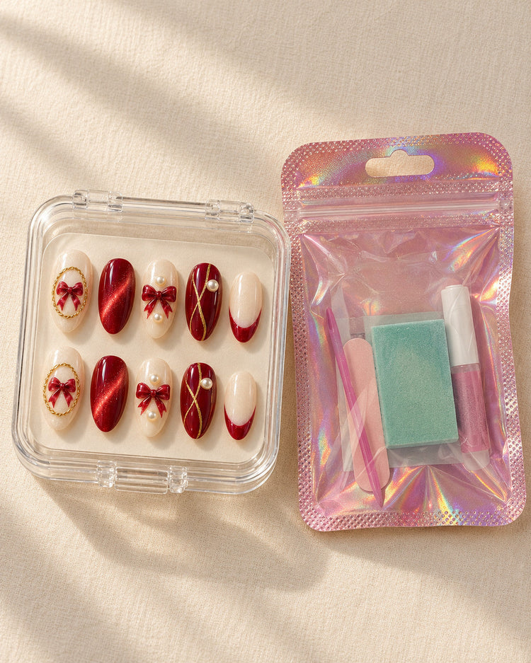 Golden Cameo hand-painted press-on nails — in clear case beside application kit. Design preview.