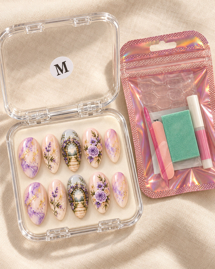 Garden Vows hand-painted press-on nails — in clear case beside application kit. Design preview.