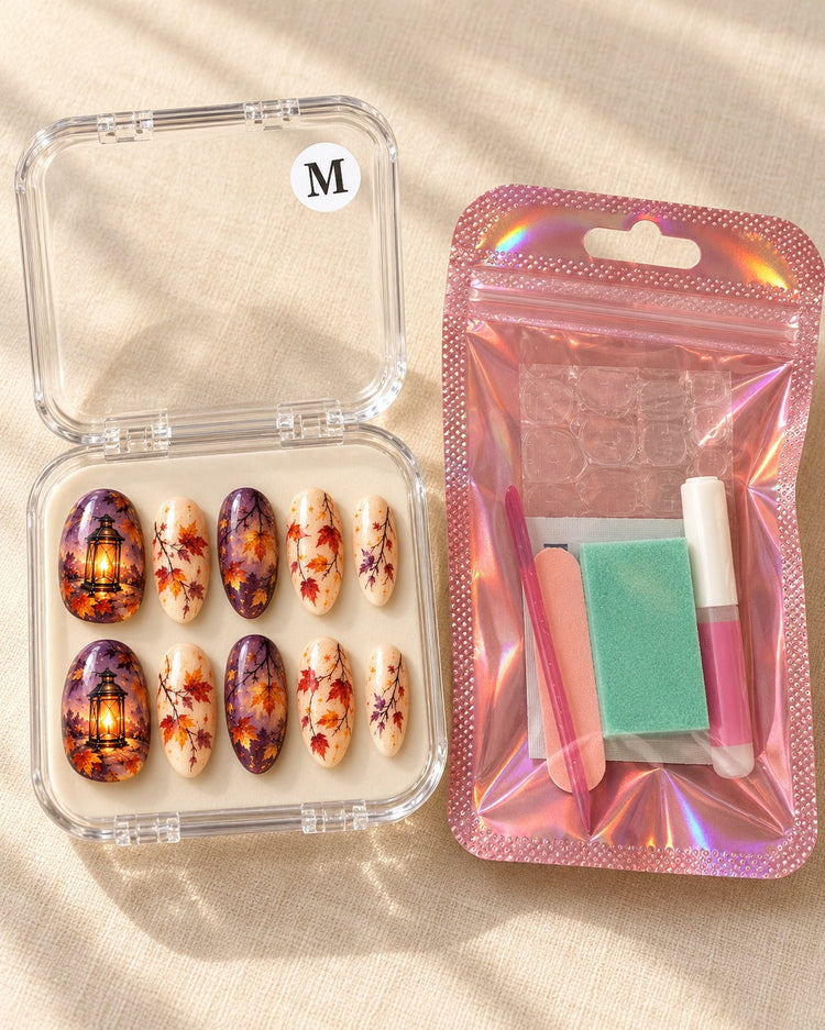 Amber Vigil ten-nail set in a clear case beside application kit, design preview
