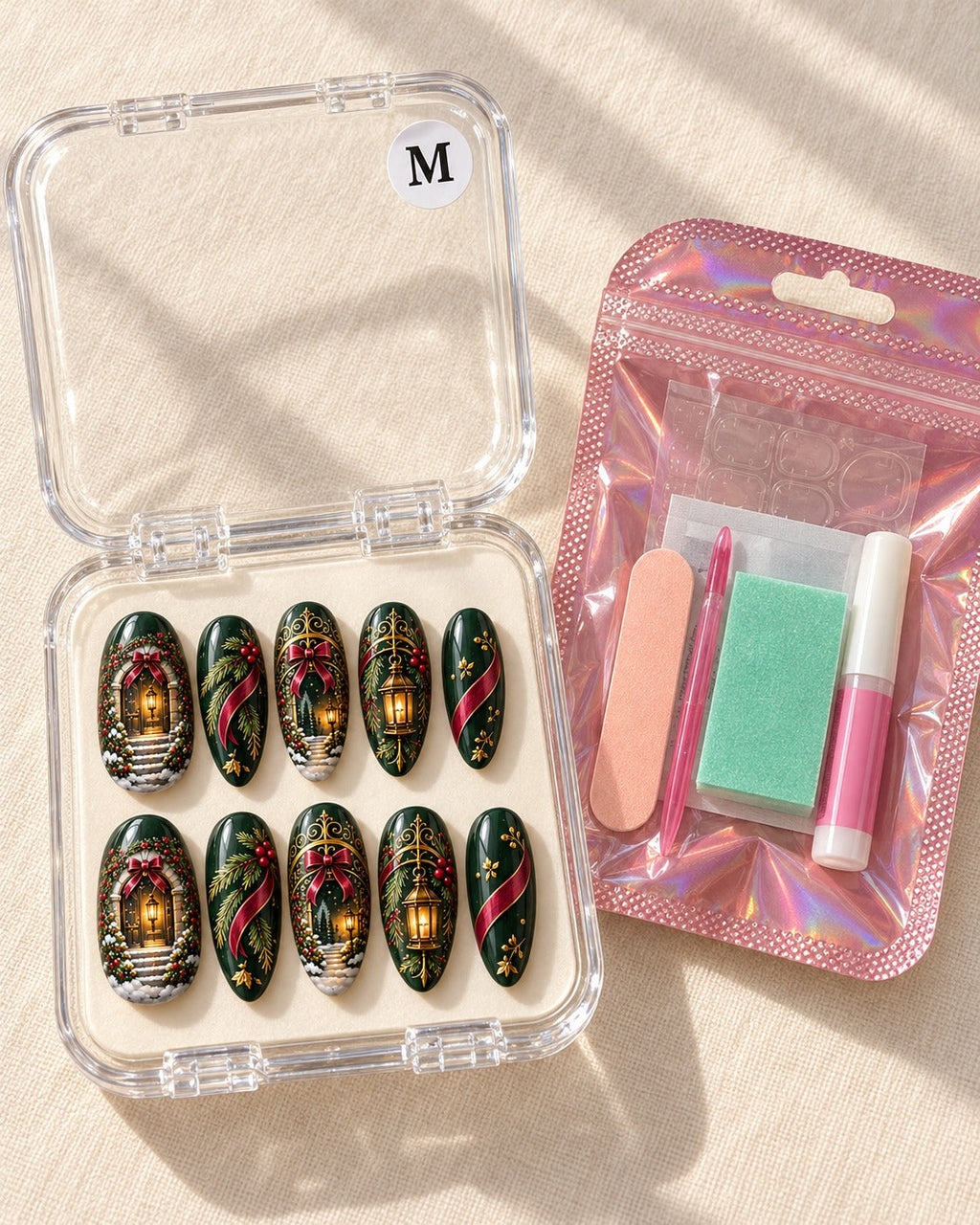 Gilded Evergreen Arch ten-nail set in a clear case beside application kit, design preview