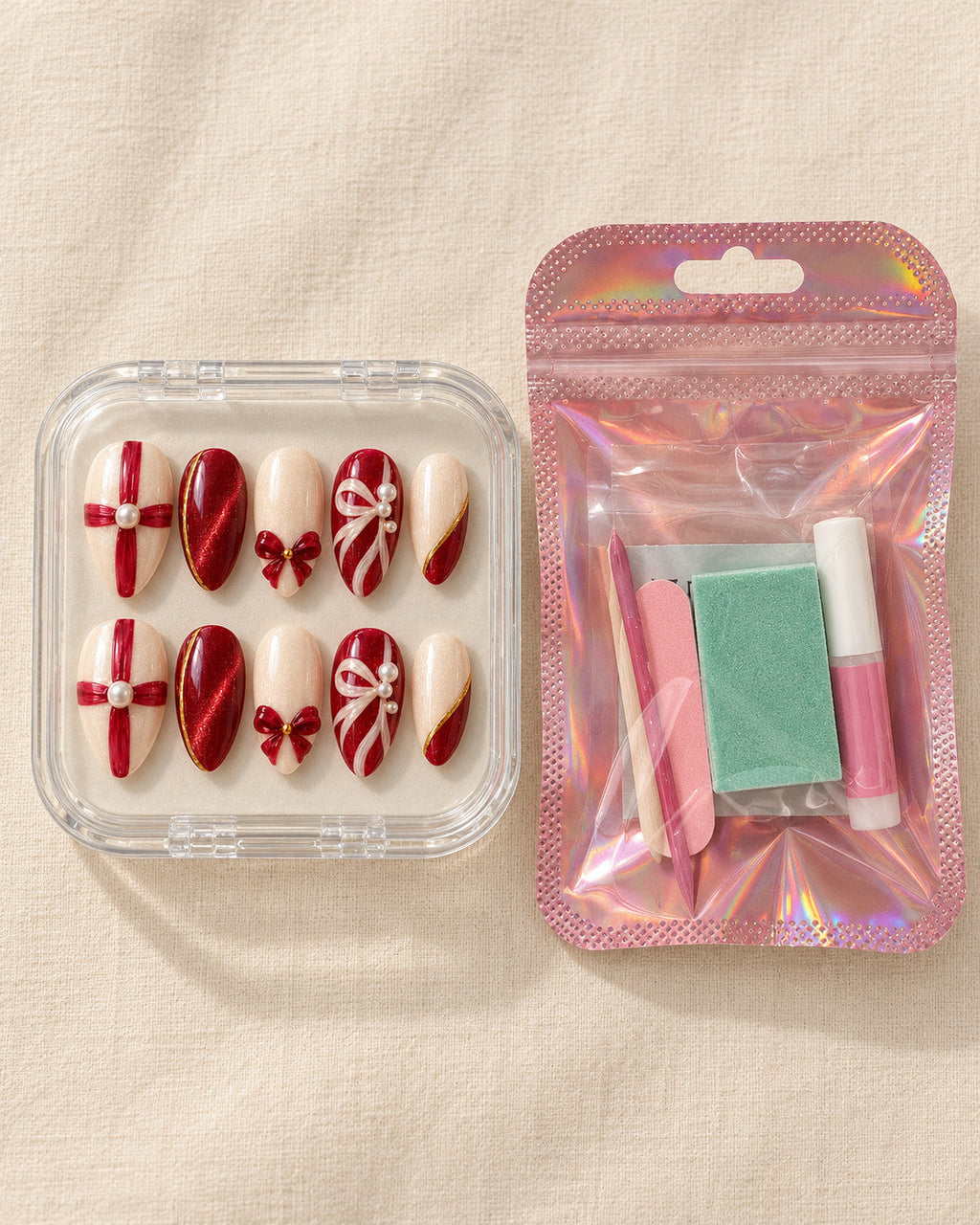 Giftwrap Crossing hand-painted press-on nails — in clear case beside application kit. Design preview.