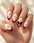 Christmas Red French Bow Hand-Painted Press-On Nails — on a hand, AI design preview (S5 setting)