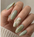 Pistachio Vein Almond Medium Hand-Painted Press-On Nails shown on a hand — AI design preview