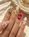 Orchid Garden 3D hand-painted press-on nails shown on a hand