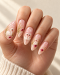 Winter Swans hand-painted press-on nails shown on a hand
